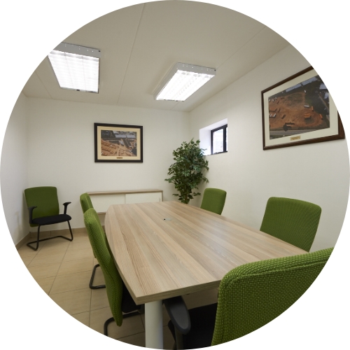 green chairs and table in a room